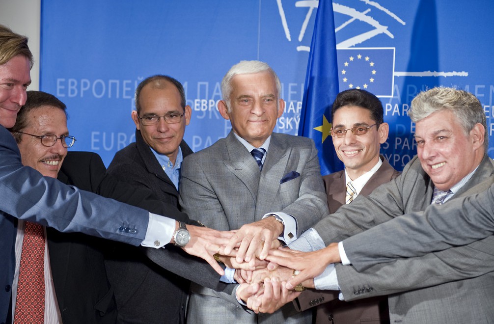 People standing before the EU banner crossing hands, Spotlight Europe