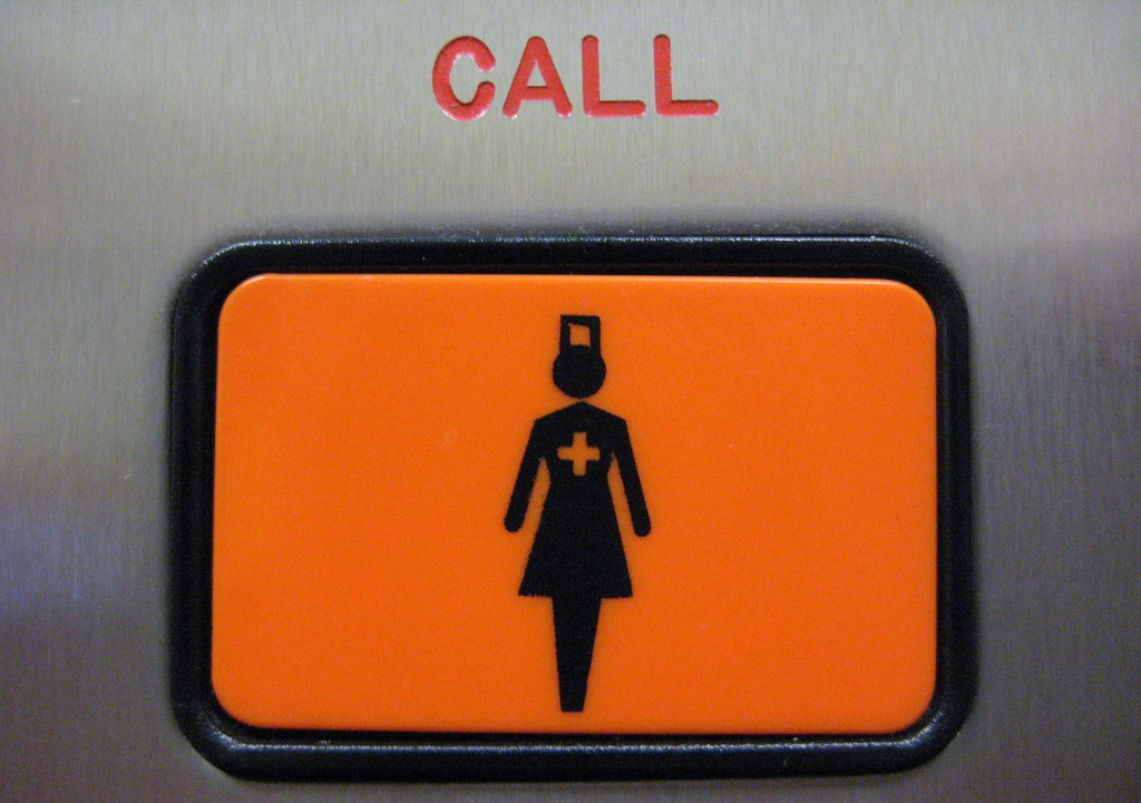 Call- button with a nurse figure on it, Spotlight Europe