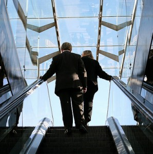 Two people standing on an escalator, Spotlight Europe